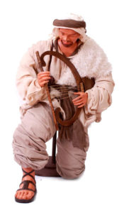 pastor nacimiento arrodillado